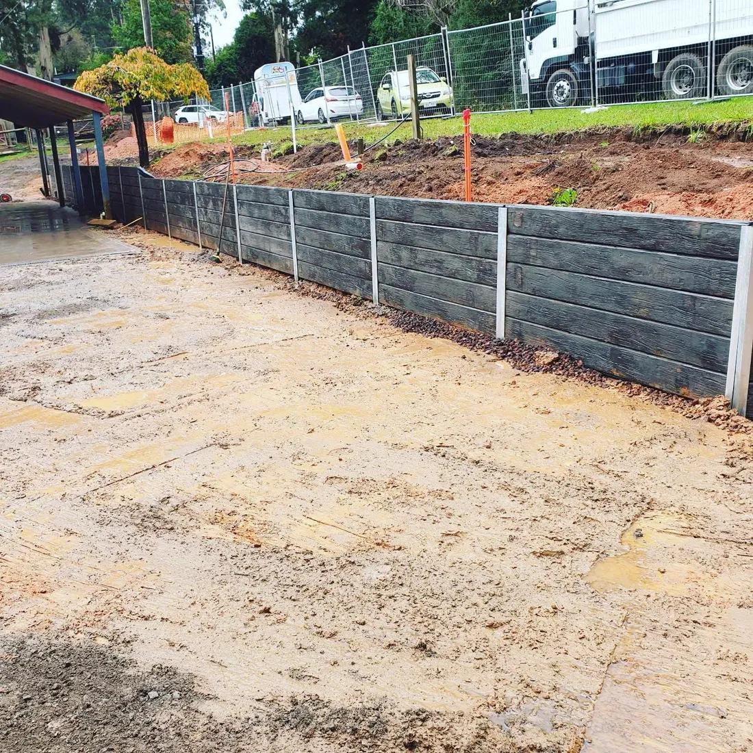 Finished grey sleeper retaining wall