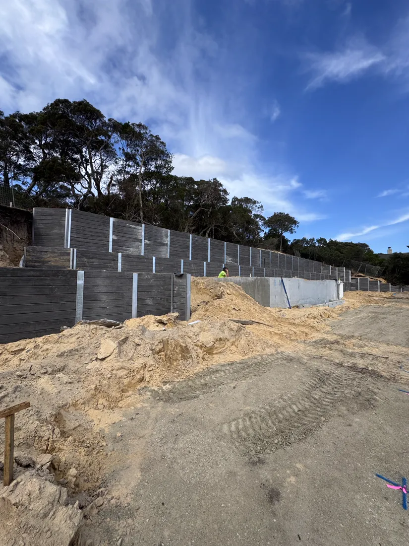 Completed multi-tier sleeper retaining wall